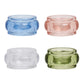 The Provence Napkin Ring Collection by Juliska features four rounded, bubbly glassware napkin rings in blue, pink, clear, and green, displayed against a white background.