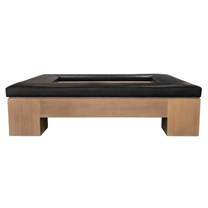 The Mikos Cocktail Ottoman by Hickory Chair features a square wooden base with a recessed center and a luxurious black Empire Atlantis Leather cushioned top, presented against a white background—a modern statement piece that seamlessly combines style and comfort.