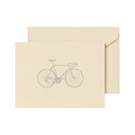 The Crane Racing Bike Note Card Set features a beige folded card with a grey racing bike illustration, paired with a matching envelope—ideal for thank you notes.