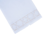 Elevate your home décor with the Bamboozle Bath Collection by Haute Home—this elegant white linen napkin features premium linen and a decorative geometric embroidered border in light beige thread along one edge, shown folded against a white background for a sophisticated touch.