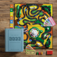 The image showcases The Game of Life Vintage Bookshelf Edition by WS Game Company set up with the board, cards, money, spinner, and game pieces neatly arranged for play. A closed game box and instruction booklet are placed beside the board, adorned with vintage graphics that add a touch of nostalgic charm.