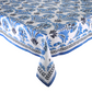 A rectangular table covered with a Kim Seybert Botanica Tablecloth featuring a vintage blue and black floral pattern and a decorative border.