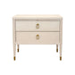 The Hickory Chair Sydney Nightstand showcases a light American Ash finish, two drawers with gold rectangular handles, and tapered legs with gold tips in a refined Mid-Century style, displayed against a white background.