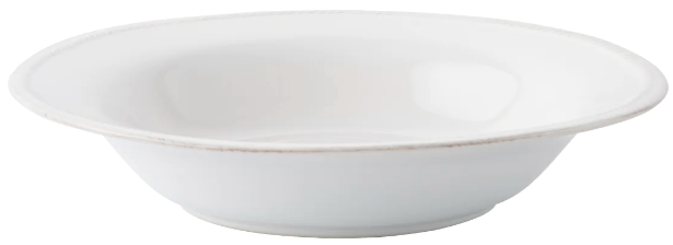 A white ceramic shallow bowl from the Juliska Berry & Thread Classic Whitewash Dinnerware Collection, featuring a slightly raised rim—ideal as a pasta bowl or elegant dinner plate, shown against a plain background.