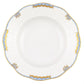 The Herend Princess Victoria Light Blue Collection features a white porcelain plate with a textured rim, hand painted in light blue, gold, and white accents, inspired by the timeless Queen Victoria collection.