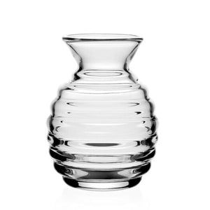 The Ripples Posy Vase by William Yeoward Crystal features expert glassblowing with flared rim and ridged, rounded body, making it a striking accent against a plain white background.
