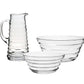 The William Yeoward Crystal Ripples Serveware Collection, featuring a clear glass pitcher and two bowls with horizontal ridges, is displayed on a white background for an artisanal touch.