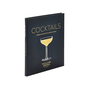 A hardcover book, "Williams Sonoma: Cocktails" by Graphic Image, features a gold cocktail glass on a black cover—ideal for home bar enthusiasts looking for modern cocktail recipes.
