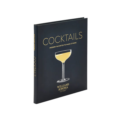 A hardcover book, "Williams Sonoma: Cocktails" by Graphic Image, features a gold cocktail glass on a black cover—ideal for home bar enthusiasts looking for modern cocktail recipes.