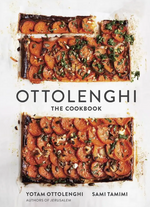 Cover of “Ottolenghi, The Cookbook” by Penguin Random House featuring two rectangular tarts topped with sliced vegetables and herbs on a white background, perfectly capturing the vibrant spirit of Mediterranean cuisine. Authors Yotam Ottolenghi and Sami Tamimi are listed at the bottom.