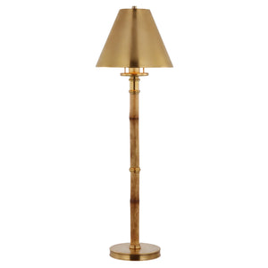 The Visual Comfort Dalfern Desk Lamp in waxed bamboo and brass features a brass shade and elegant cylindrical base.