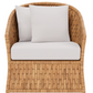 The Indra Lounge Chair by Made Goods features a woven water hyacinth design, complemented by a white seat cushion and two white back pillows for a comfortable, organic look.