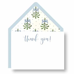 The Bluebell Thank You Note Set by Haute Papier features blue script text, a light blue envelope, and decorative liners with a floral and bow pattern inside the flap.
