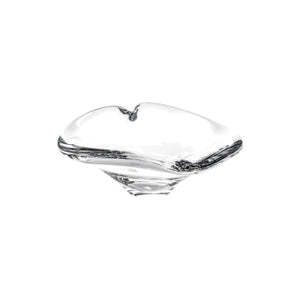 The Simon Pearce Romance Heart Dish is a clear glass bowl with smooth curves and a slightly raised center, perfect as a jewelry holder or romantic table accent, shown on a white background.