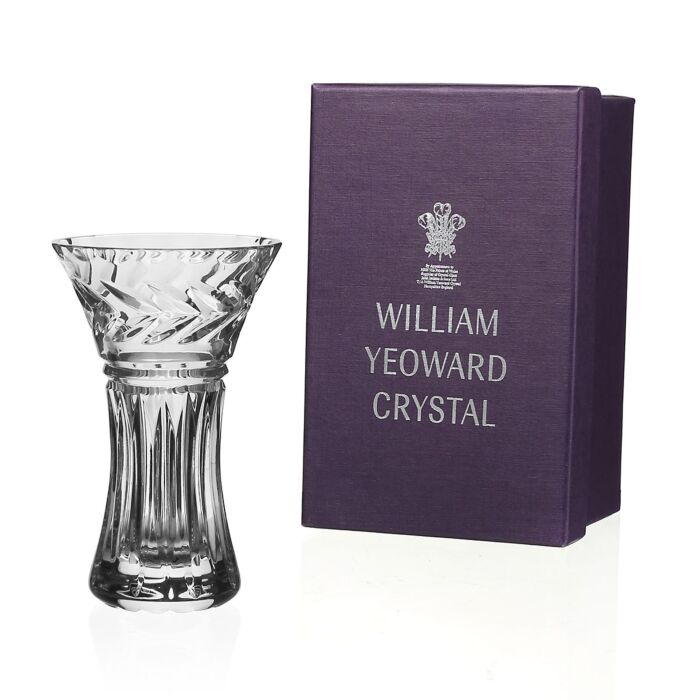 The Rosie Posy Vase by William Yeoward Crystal stands next to a purple box marked with the brand’s name and emblem—an elegant hostess gift or stylish centerpiece for your dining table.
