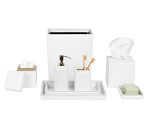 The Rothwell Bath Collection by Pigeon & Poodle features water-resistant, durable white accessories: waste bin, tissue box, soap dispenser, toothbrush holder, tray, covered jar, and a soap dish with soap and cotton balls.