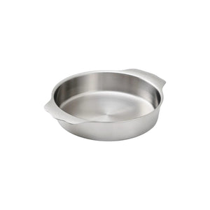 The Hestan Provisions OvenBond Round Baker with two side handles is displayed on a plain white background, featuring oven and broiler safe construction for versatile baking.