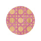 The Epoch Versailles Collection by HestiaLiving features a round bamboo mat with intersecting pink lines forming hexagons and squares on a natural background—perfect for outdoor dining or adding woven caning style to your holiday entertaining.