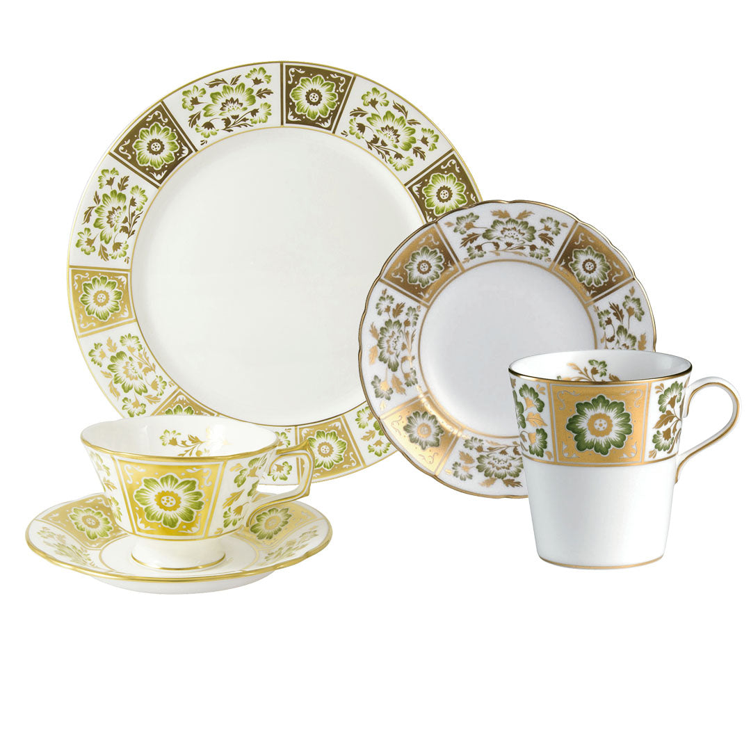 The Royal Crown Derby Panel Green Dinnerware Collection features four fine bone china pieces—two plates, a teacup with saucer, and a mug—adorned with elegant gold and green floral patterns, reflecting timeless British artistry.