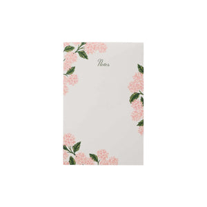 The Pink Hydrangea Collection notepad by Rifle Paper Co. features "Notes" at the top center, with pink hydrangea flowers and green leaves along the edges—a charming addition to your paper goods.