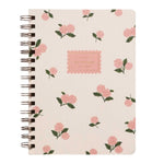 The Pink Hydrangea Collection spiral-bound notebook by Rifle Paper Co. features a cream cover with pink hydrangeas and green leaves, plus a central "NOTEBOOK" label—ideal for anyone who loves elegant paper goods.