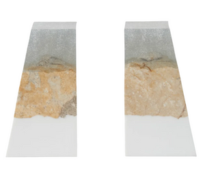 The Otis Bookends by Made Goods feature a rectangular sand resin build with a layered look: white bases, natural coral stone centers, and a translucent upper section.
