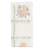 The Kim Seybert Trellis Napkin Set features folded white napkins embroidered with pink and purple flowers and green vines—perfect spring table accents or charming Easter napkins.