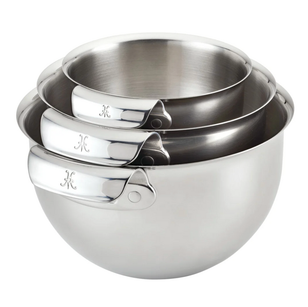 The Hestan Provisions Stainless Steel Mixing Bowl 3-Piece Set offers three dishwasher-safe bowls that nest together, featuring ergonomic handles and a stylish embossed letter.