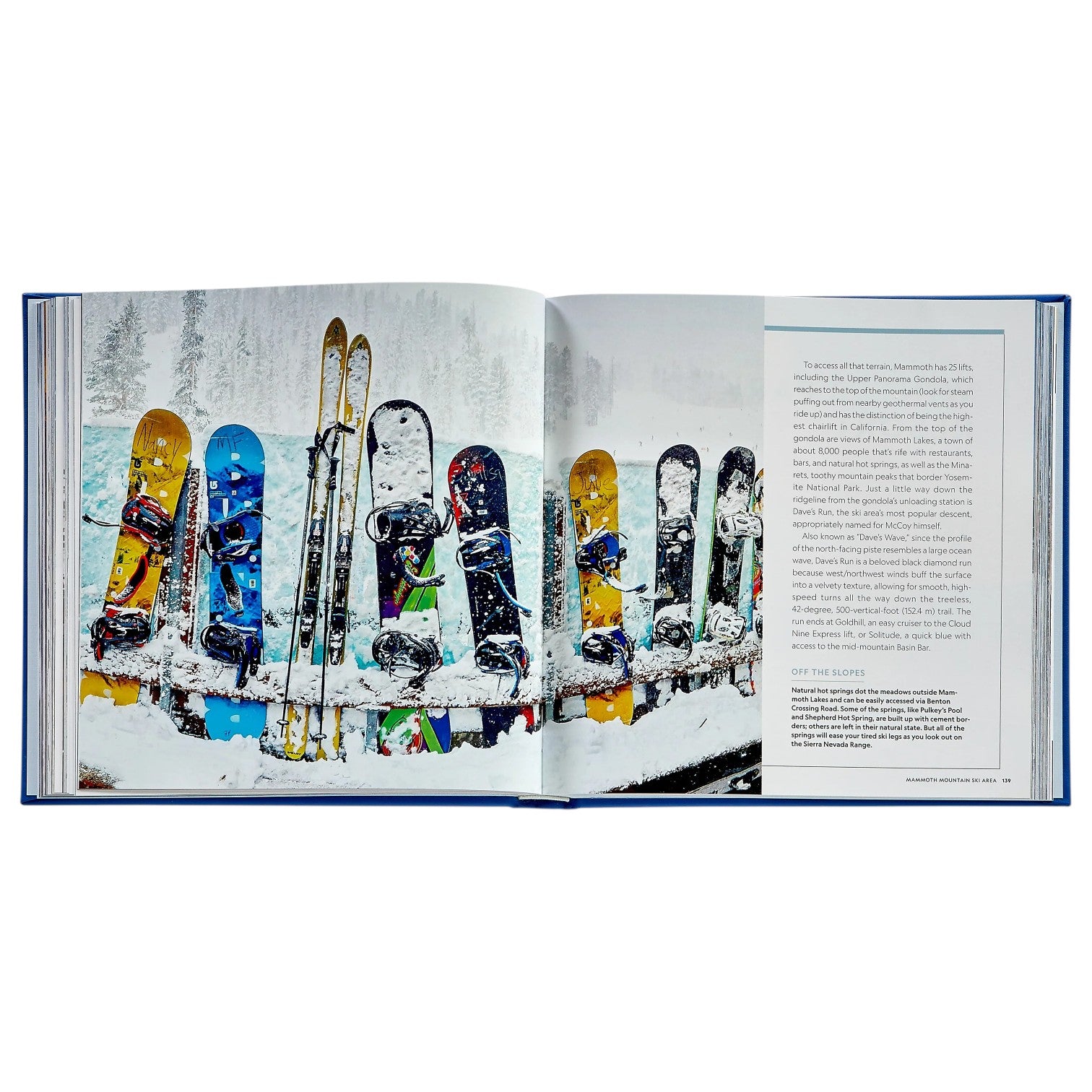An open book, "100 Slopes of A Lifetime" by Graphic Image, shows skis and snowboards in snowy scenery—ideal for sparking your ski bucket list or exploring top destinations.