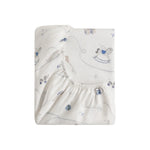 The Gooselings Little Toy Chest Bedding Collection fitted crib sheet features playful blue and gray rocking horses, building blocks, and balls on white—perfect for children’s bedding and creating sweet dreams.