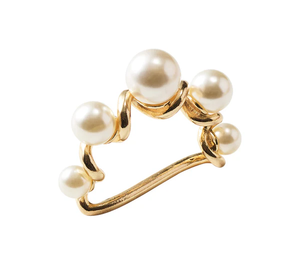 The Kim Seybert Pearl Drift Napkin Ring in pearl and gold features an open, irregular gold band accented with five white pearls—an elegant touch for any formal table setting.