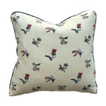 The Flora Calico Pillow by Hive Custom Pillows is a 22x22 square pillow featuring a cream background with small red and blue floral motifs—ideal as a handmade accent for any space.