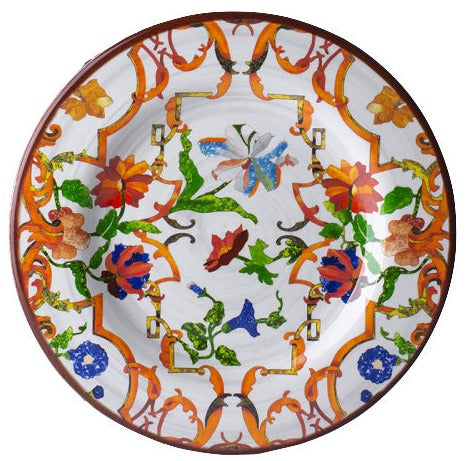 The Pancale White Melamine Dinnerware Collection by Mario Luca Giusti features a vibrant floral and vine motif in orange, green, blue, and red on a white background.