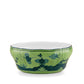 A green ceramic bowl with a scalloped rim from the Ginori 1735 Oriente Italiano Malachite Collection, featuring blue floral and landscape motifs inspired by exotic Ginori ceramics.