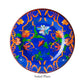 The salad plate from the Mario Luca Giusti Pancale Blue Collection features a blue base with orange and green floral patterns centered by a white flower. Ideal for outdoor entertaining, this durable melamine dinnerware blends style and function.