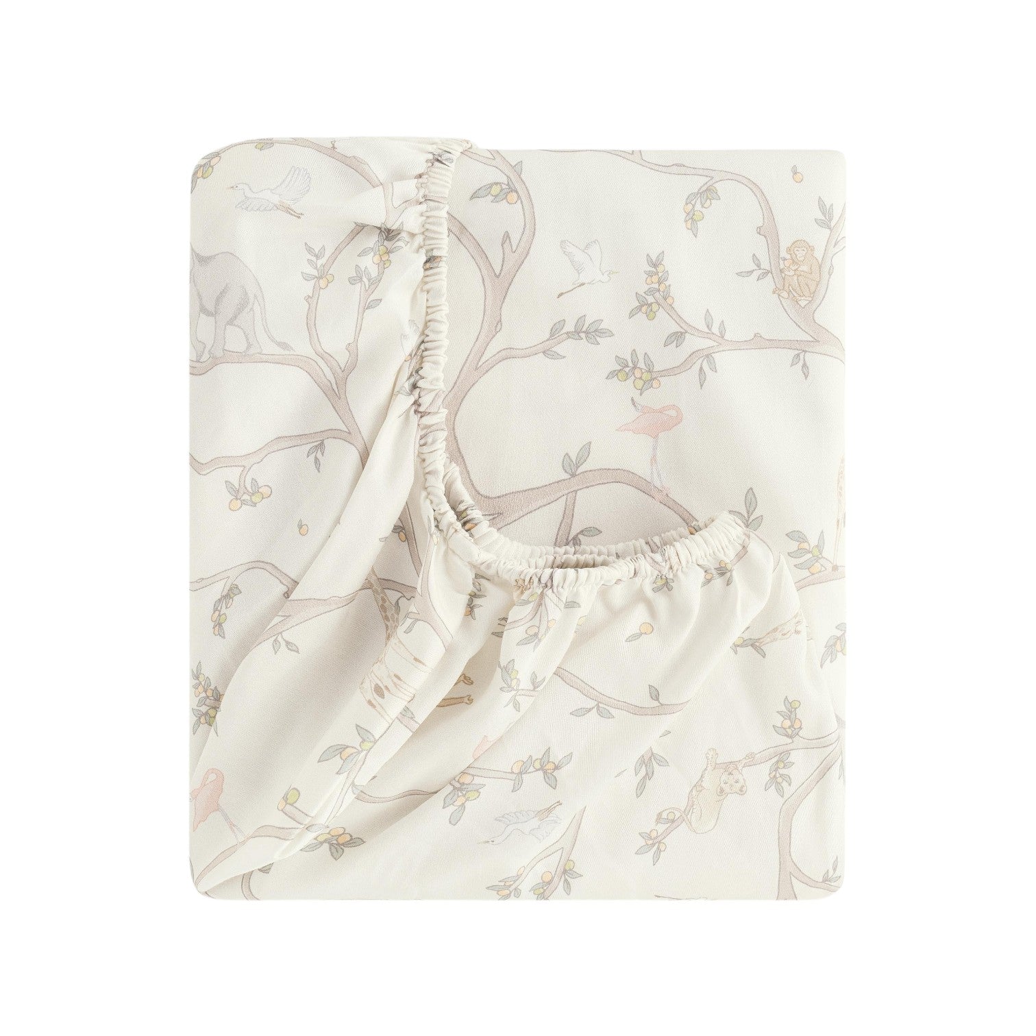 The Gooselings Animal Parade Ivory Bedding Collection features a folded fitted crib sheet in pale beige with a subtle pattern of tree branches, birds, and animals—perfect for cozy children’s bedding and sweet dreams.
