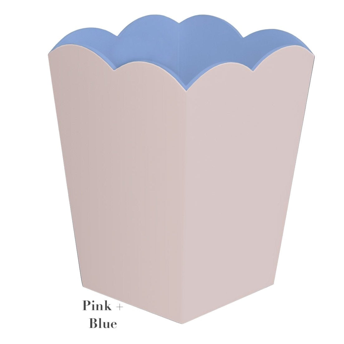 This pink waste bin from the Addison Ross Scalloped Lacquer Collection showcases a striking blue interior, echoing Addison Ross's refined design.