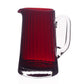 Fanny Scarlet Drinkware Collection pitcher in red glass with vertical ribs and a clear glass handle.