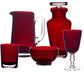 A Fanny Scarlet Drinkware Collection set of scarlet barware including a red glass pitcher, decanter, tumbler, bowl, and stemmed wine glass.