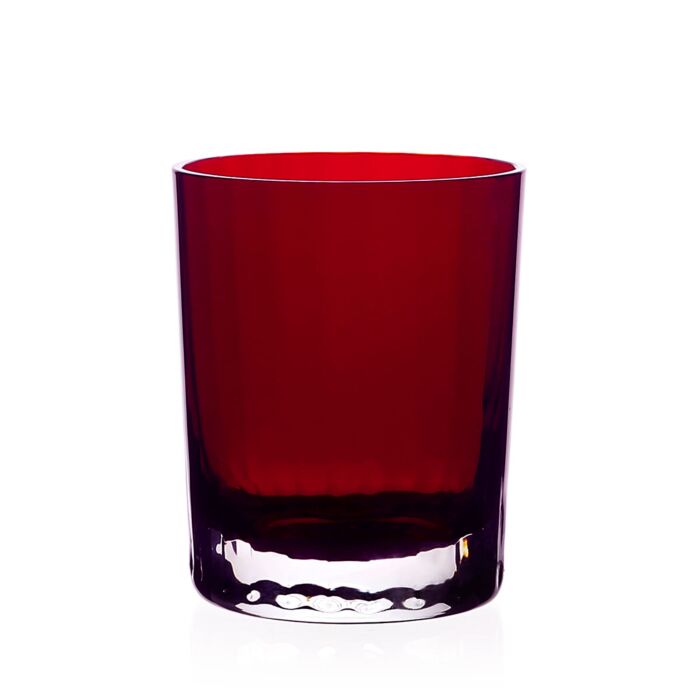 A deep red glass tumbler from the Fanny Scarlet Drinkware Collection by William Yeoward Crystal, featuring a heavy, dimpled base.