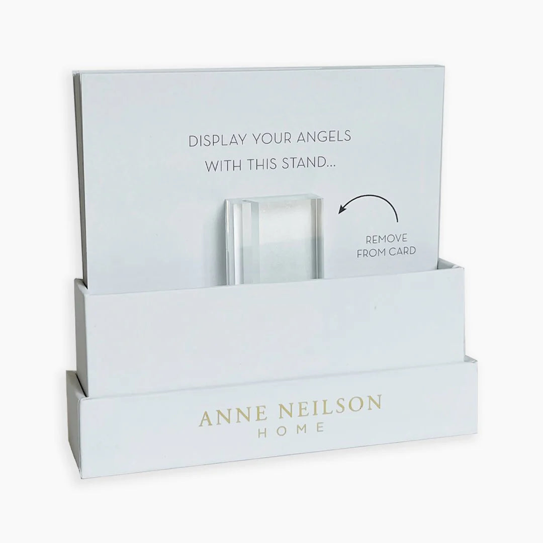 White display box labeled "Anne Neilson" holds Anne Neilson Friendship Scripture Cards and a clear acrylic stand; remove the stand from the card for a beautiful angel card display.