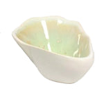 The AE Ceramics Small Sauce Bowl Collection features handmade bowls with a glossy pale green interior and matte white exterior—perfect for adding coastal charm to your ceramic dinnerware.