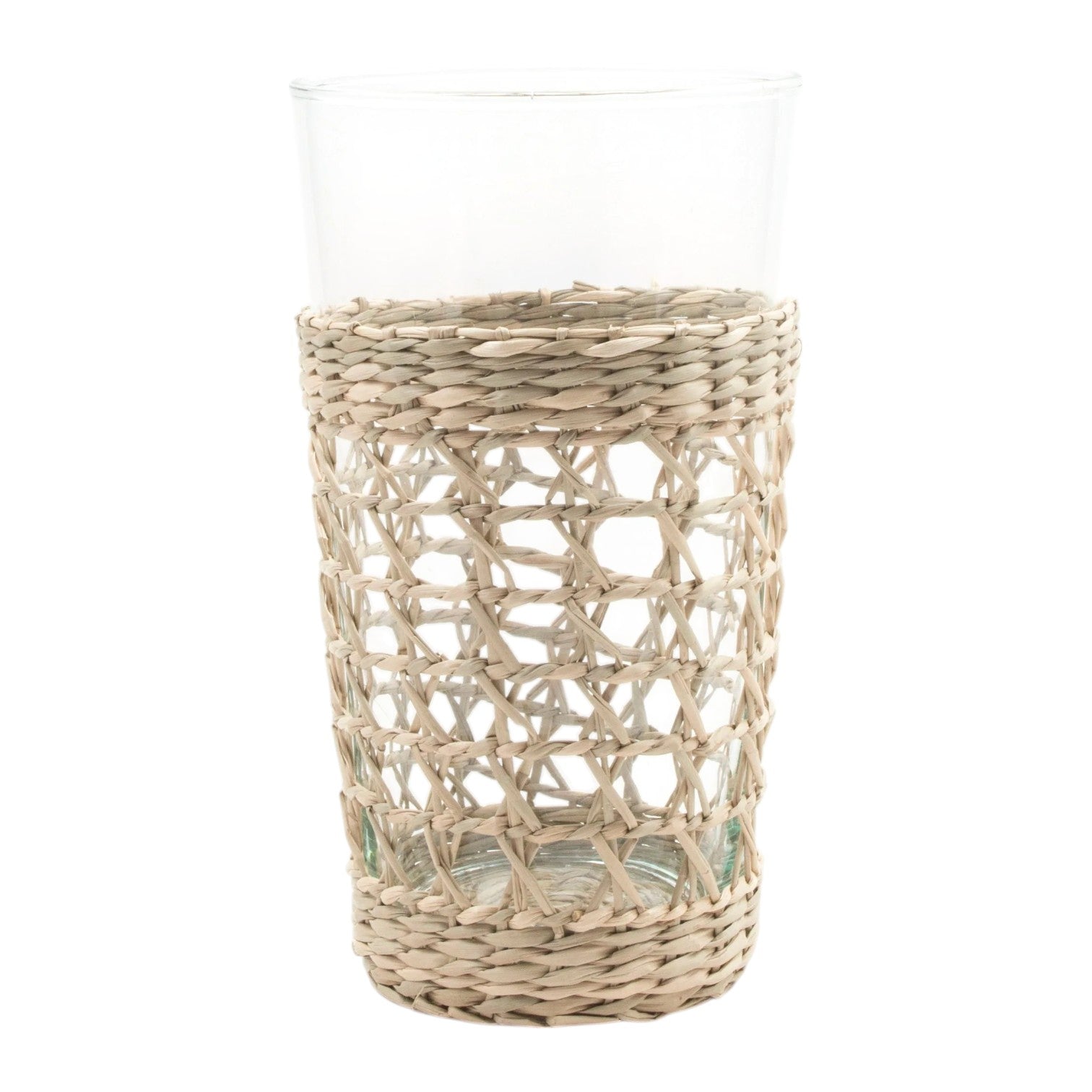 The Be Home Seagrass Cage Glassware Collection features clear glass tumblers partially wrapped in removable seagrass, blending natural style with modern design.