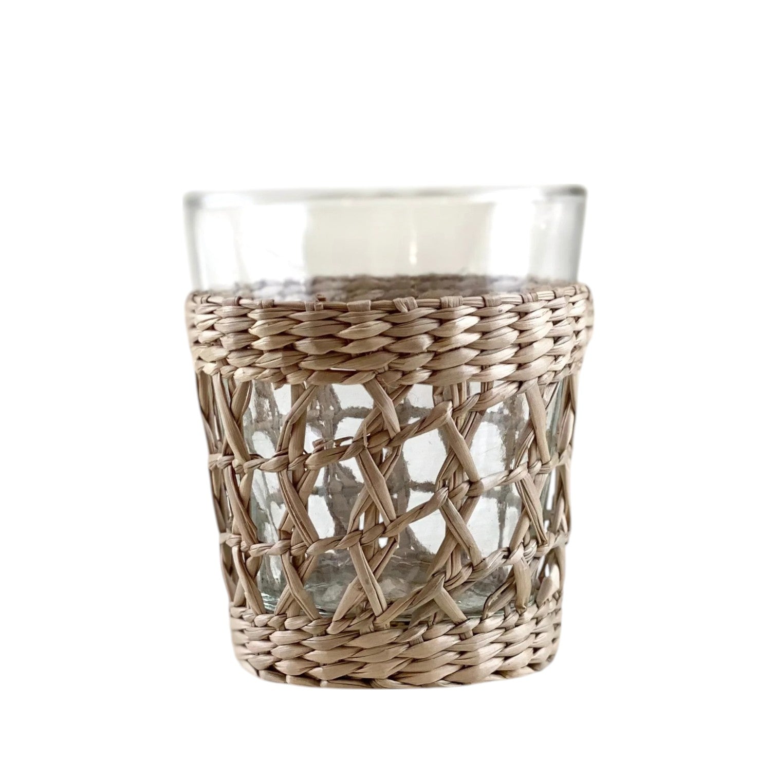 The Be Home Seagrass Cage Glassware Collection features clear glass tumblers with removable seagrass wrapping on the lower half, adding a natural touch to your cocktail glassware.