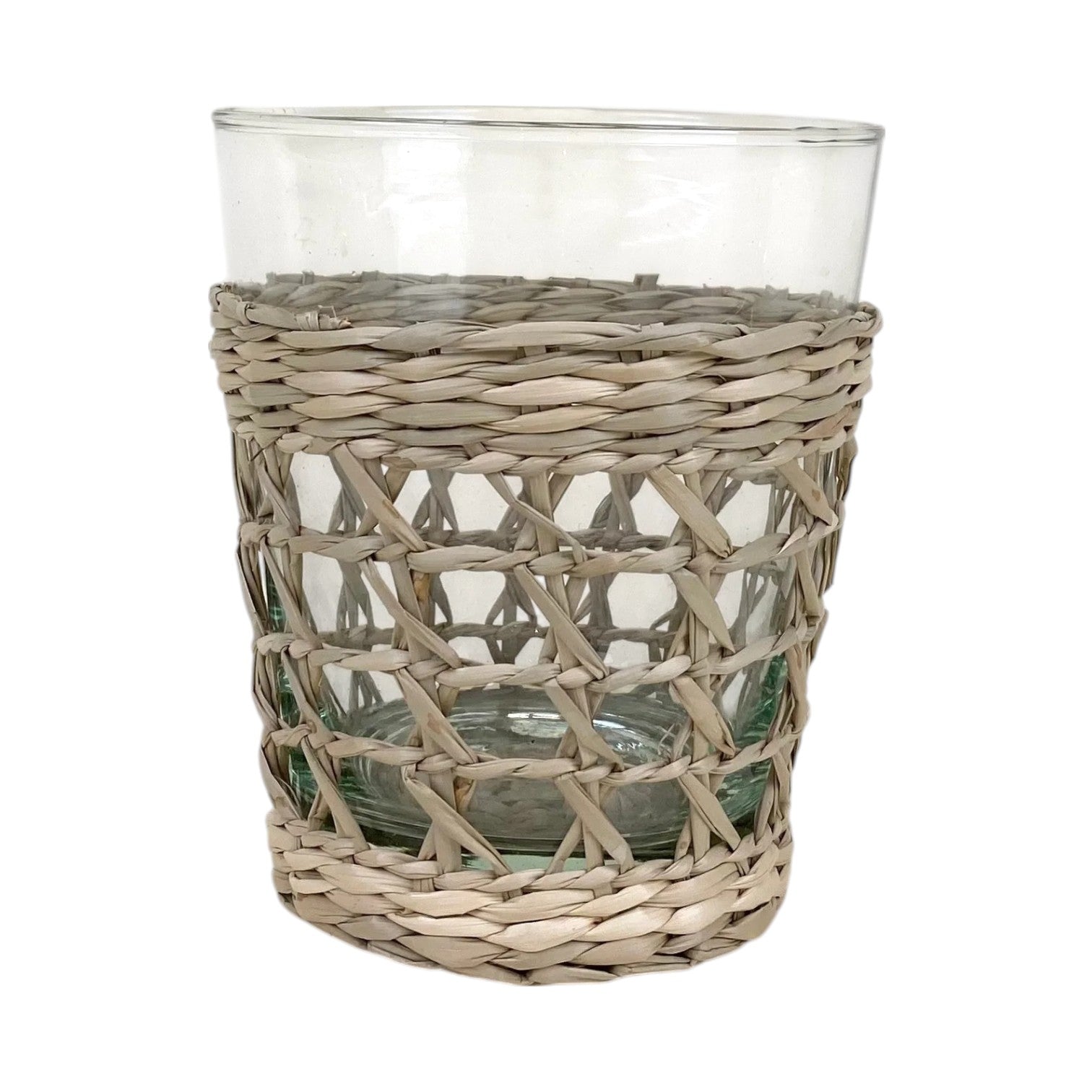 The Be Home Seagrass Cage Glassware Collection features clear glass tumblers partially wrapped with woven rattan, ideal for those who love unique seagrass-inspired drinkware.