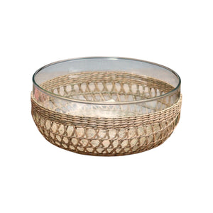 The Removable Seagrass Cage by Be Home features a clear glass bowl encased in a handwoven rattan outer layer, with intricately woven seagrass details that add charming texture—perfect for enhancing rustic decor, shown on a white background.