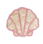 The Rosy Seashell Napkin Ring by Mercedes Salazar features a handcrafted woven rattan design with pink edging, inspired by playful elegance.