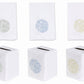 Six white premium linen pieces from Haute Home’s Sea Urchin Bath Collection, featuring coral-inspired patterns: three hand towels above in assorted pastel shades, and three matching tissue box covers below with top slots—an elegant addition to your home décor.