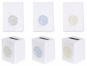 Six white premium linen pieces from Haute Home’s Sea Urchin Bath Collection, featuring coral-inspired patterns: three hand towels above in assorted pastel shades, and three matching tissue box covers below with top slots—an elegant addition to your home décor.
