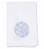 Elevate your refined home décor with the Sea Urchin Bath Collection by Haute Home—a premium linen white cloth napkin adorned with a light blue circular dotted pattern at its center, beautifully displayed against a plain background.